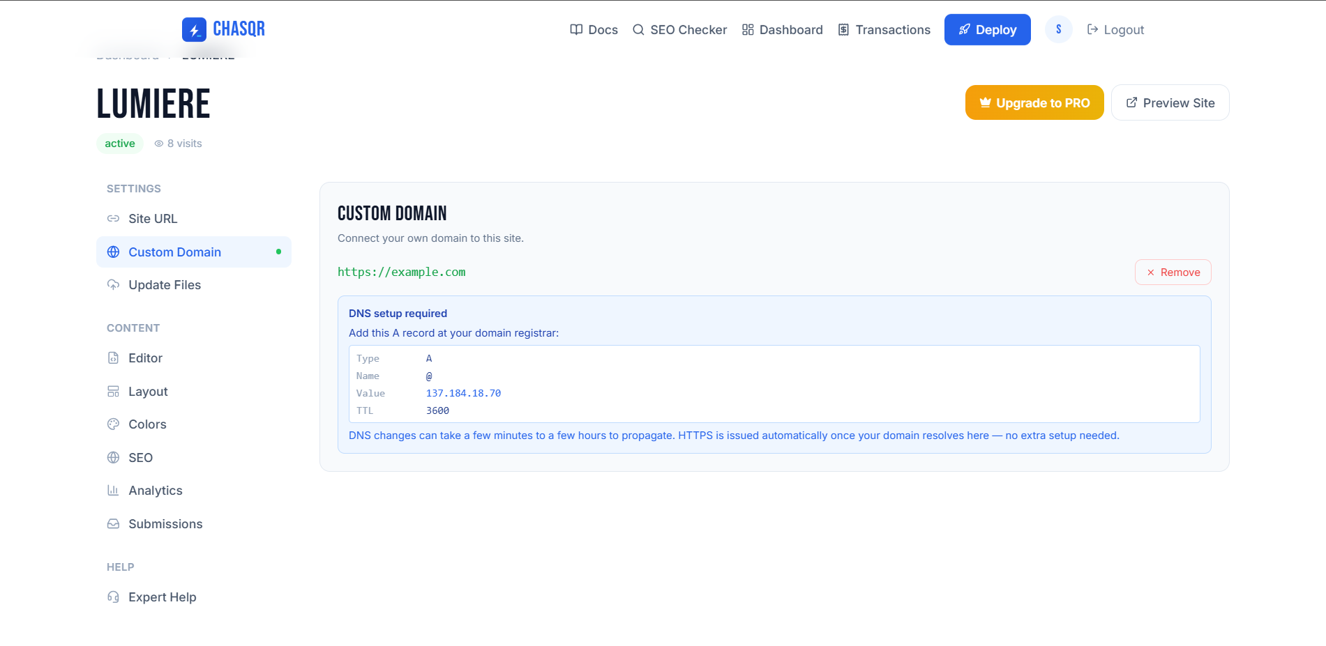 Once saved, the tab shows the exact A record to create at your registrar — and a green dot marks the site as having a domain.